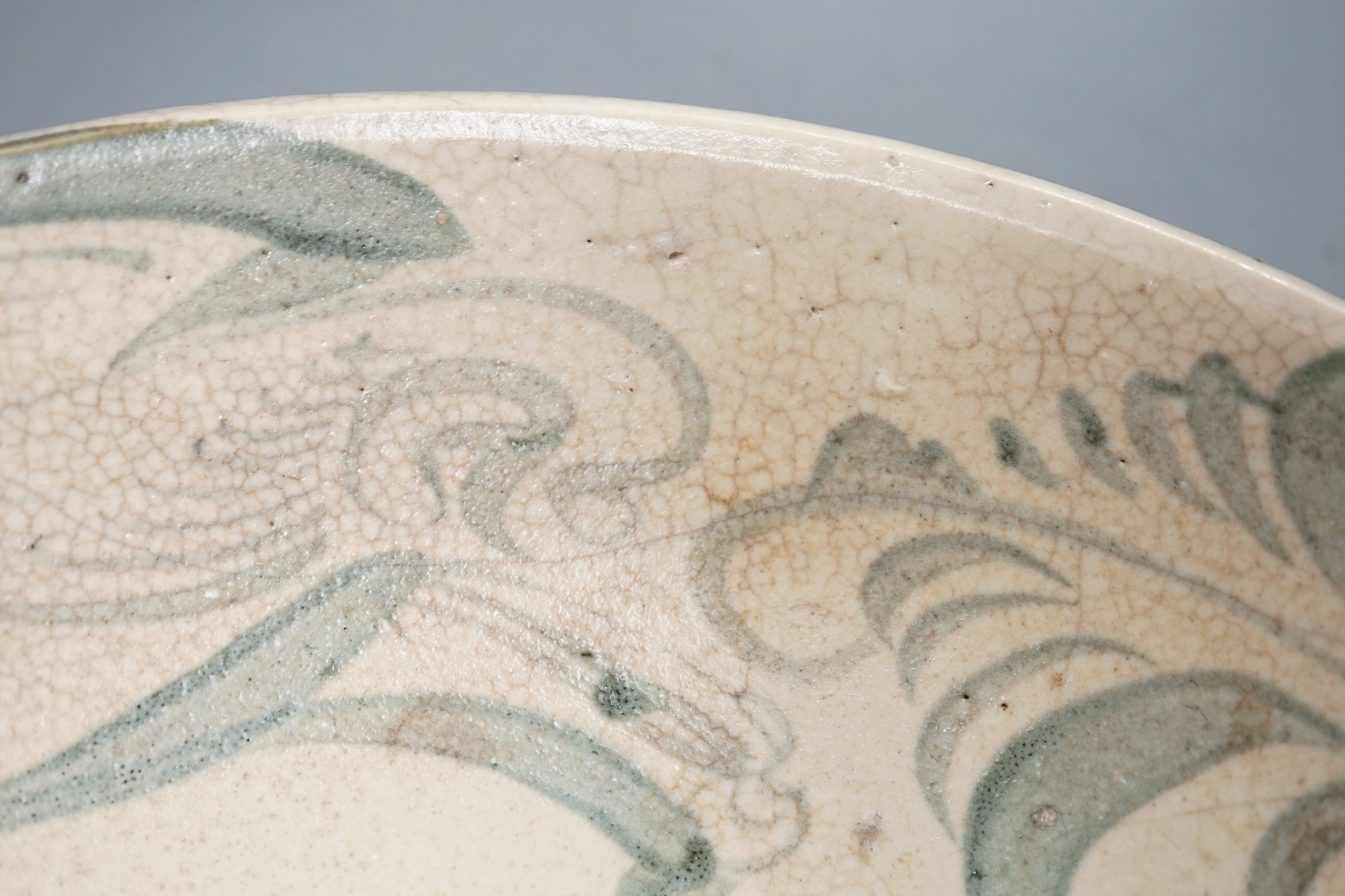 A Chinese provincial blue and white ‘kitchen Qing’ dish 32.5cm diameter